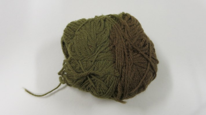 Detail of the ball of wool showing most fading.