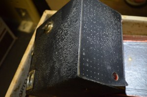 Box brownie camera with active mould affecting leather surface.