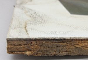 Water damaged window mat and strawboard backing board.